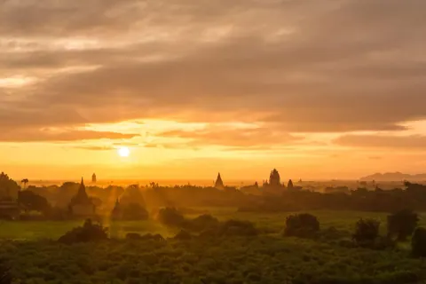 Sunrise over the ancient pagodas of Bagan, Myanmar, in golden morning light